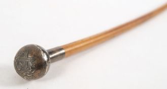 A silver mounted swagger stick with regimental crest to pommel:, 69cm long.