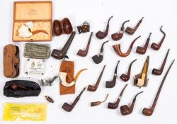 Dunhill, Briar, Petersen, Meerschaum and others, a collection of pipes, ashtrays and rests:,