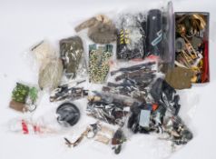 A large collection of various Action Man weapons, uniforms and accessories:,