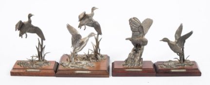 A group of four pewter bird figures:, comprising a Barn Owl and three others of Mallards,