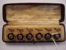 A set of six gilt metal and agate target dress studs:, with mother of pearl surrounds,