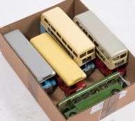 A group of five Tri-ang Minic clockwork and friction drive buses in various London Transport