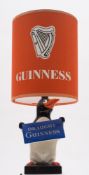 A Carlton Ware 'Draught Guinness' Penguin lamp with shade:,