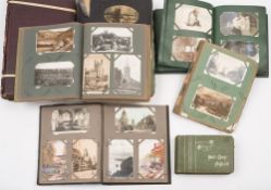 A collection of seven early 20th century postcard albums and content:,