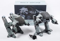 A Hot Toys 1/6th scale Robocop 'ED-209' MMS-204:, together with one other ED-209 figure,