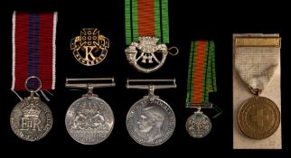 A WWI Military Cross group of four together with three other family WWI groups and medals with