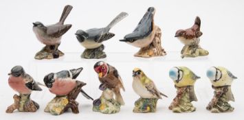 A group of ten Beswick porcelain models of birds:, including 'Wren',