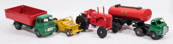 A Tri-ang friction drive 'Shell' petrol tanker:, together with a yellow clockwork 'AA' jeep,
