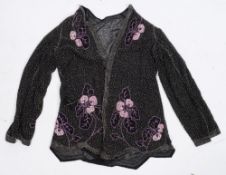 An early 20th century lady's beaded lace jacket:,