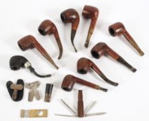 A collection of nine various briar pipes: together with a German cigar cutter,