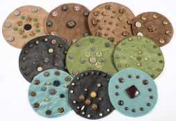 A collection of various buttons:, including a set of brown bakelite and silvered mounted buttons,