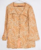 An orange and gold paisley trouser suit by Hilary Floyd, London:, size 14.