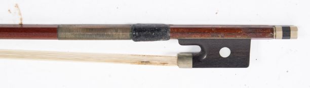 A nickel mounted violin bow stamped Dodd: with octagonal stick and mother-of-pearl inlaid frog,