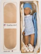A Sasha 'Doll 'BSasha Blonde Gingham' No 107:, vinyl body with blonde hair and painted face,