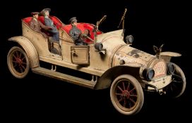 An early tinplate clockwork open top tourer, possibly by Carette:,