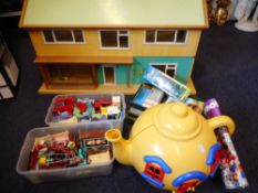 A 1960's dolls house: with hall and two ground floor rooms and three first floor rooms,