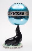 A Carlton Ware Guinness Sealion lamp with revolving shade:,