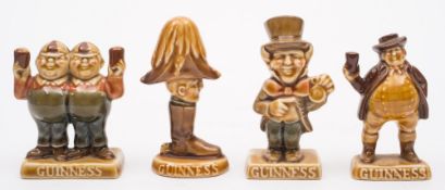 A set of four Wade Guinness advertising figures:, Wellington, Mad Hatter,
