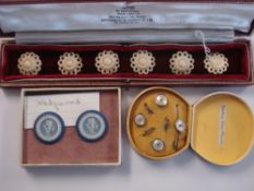A set of six carved bone circular flowerhead buttons: with pierced surrounds, 22mm diameter,
