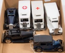 A Tri-ang Minic clockwork Taxi together with two Police cars and three Ambulances:,