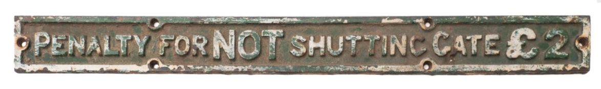 A cast iron Railway notice 'Penalty for not shutting gate £2':,