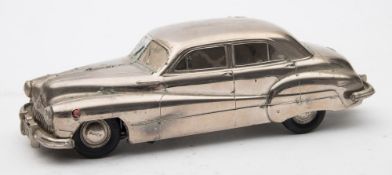 A Prameta Buick 405 clockwork sedan:, in bright polished finish and plating to windows,