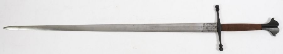 A Spanish double-handed broadsword:, stamped 'Toledo' to ricasso, blade length 96cm..