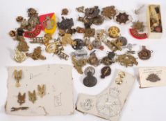 A collection of assorted military cap badges: including Glos. Rgt, Dorsetshire Rgt, R.A.S.C.