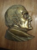 A 19th Century brass wall plaque of a bust of the Duke of Wellington:,
