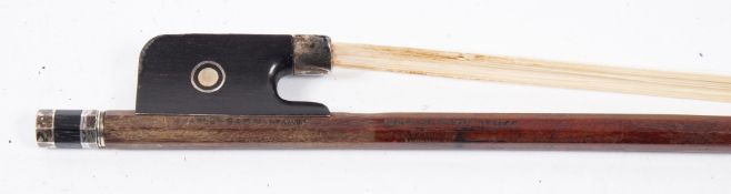 A silver mounted violin bow by Charles Bazin: with round stick and mother-of-pearl inlaid frog,
