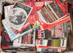 A collection of various Manchester United and Manchester City programmes:,