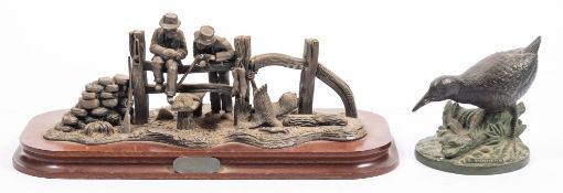 A spelter figure group 'Poachers' on a wooden base:.