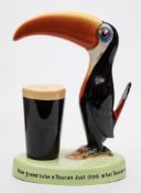A Carlton Ware Guinness Toucan lamp:, painted in colours with advertising slogan to base,