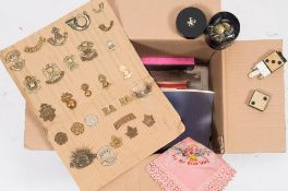 A collection of WWI & WWII cap badges and buttons together with a collection of similar buttons:,