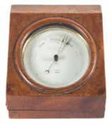 A brass cased circular aneroid barometer by Negretti & Zambra, London:,