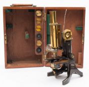 A lacquered brass microscope by J Swift & Son , London:,