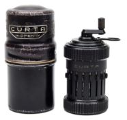 A Curta Type I No 61574 calculator by Contina AG Mauren:,