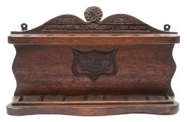 A carved wooden pipe rack recovered from the timbers of the WWI armed merchant cruiser RMS