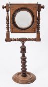 An early 19th century mahogany and ebony strung zograscope:,