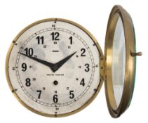 A circular bulkhead clock by Kelvin Hughes:,