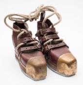 A pair of Siebe Gorman style diving boots:, brown leather uppers over brass toe caps and lead sole.