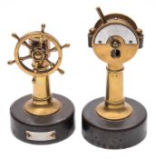 Two late 19th/early 20th century German 'nautical' cigar cutters:, one in the form of a helm,