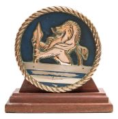 An 8 inch brass tompion from the starboard No 4 QF 5,25-inch MK1 dual purpose gun of HMS Vanguard:,