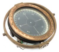 An 8 inch brass cased gyro compass:, in gimbal mount ,