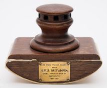 A capstan mounted desk blotter made from timber recovered by the Royal Navy Training ship from HMS