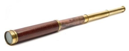 A mahogany and brass three draw telescope by Dollond, London:, 73cm extended.