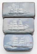A group of three Victorian marine decorated black mache snuff boxes with ship portraits:,