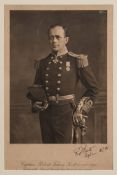 A monochrome lithograph portrait of Captain Robert Falcon Scott in Naval uniform:,