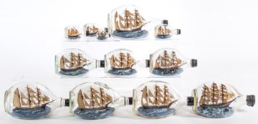 A group of twelve model ships in bottles by Roy Collins:,