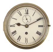 A brass cased circular bulkhead clock:, unsigned,
